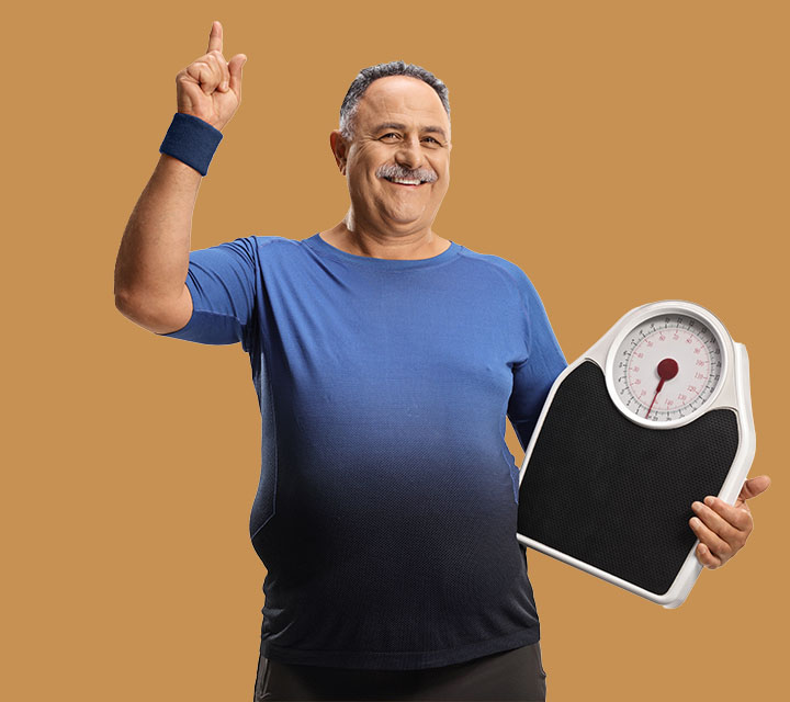 Senior Male in exercise clothes holding a scale