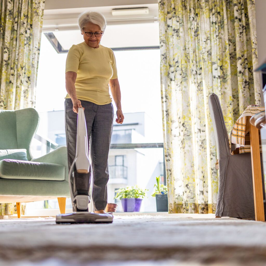 Lady is Vacuuming to stay active during Move More Month