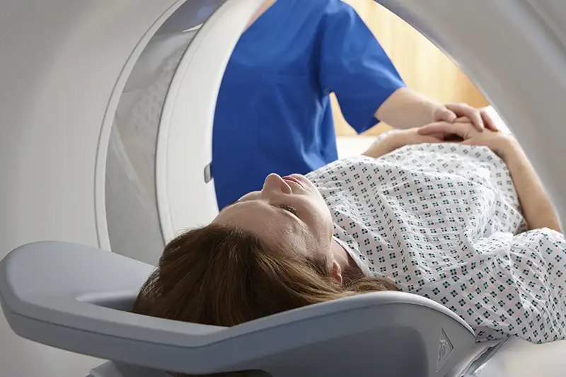 Patient preparing for a CT scan for full body and internal organ screening.