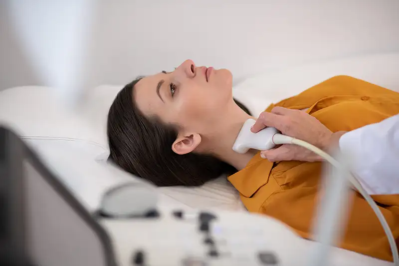 Thyroid ultrasound being performed to evaluate thyroid gland concerns.